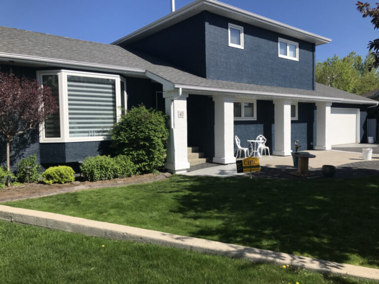 blue two story stucco coating